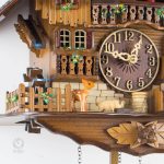 Horloge murale coucou en bois sculpté